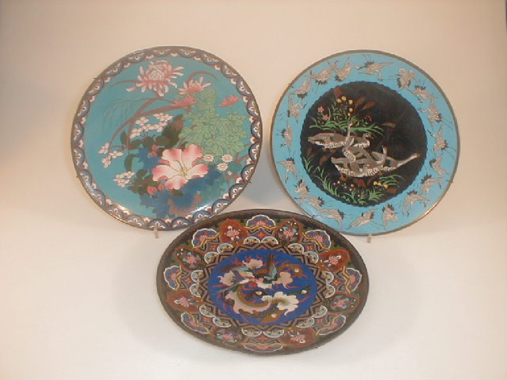 Appraisal: A Chinese closoni wall plate decorated with colourful flowers and