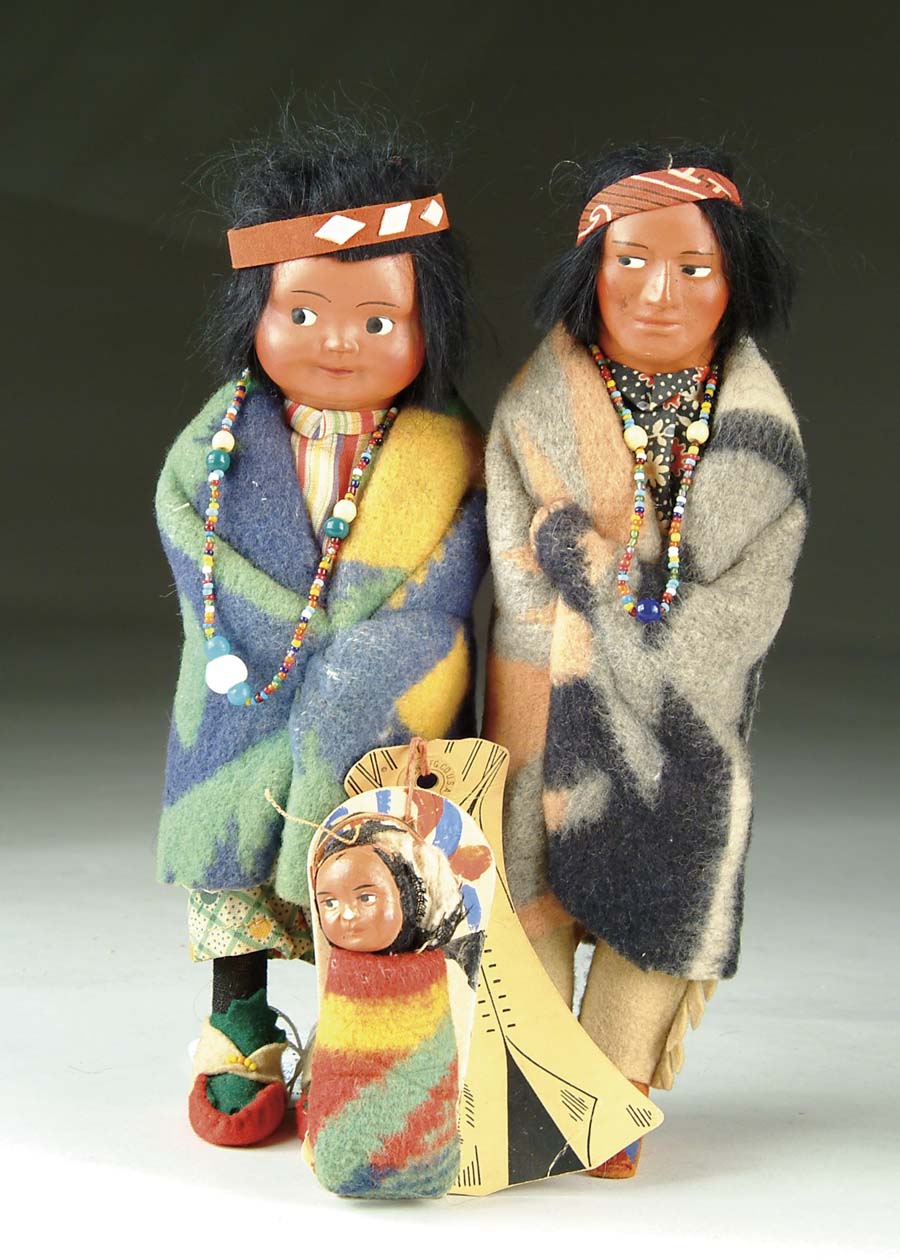 Appraisal: LOT OF THREE SKOOKUM DOLLS brave with decal on foot