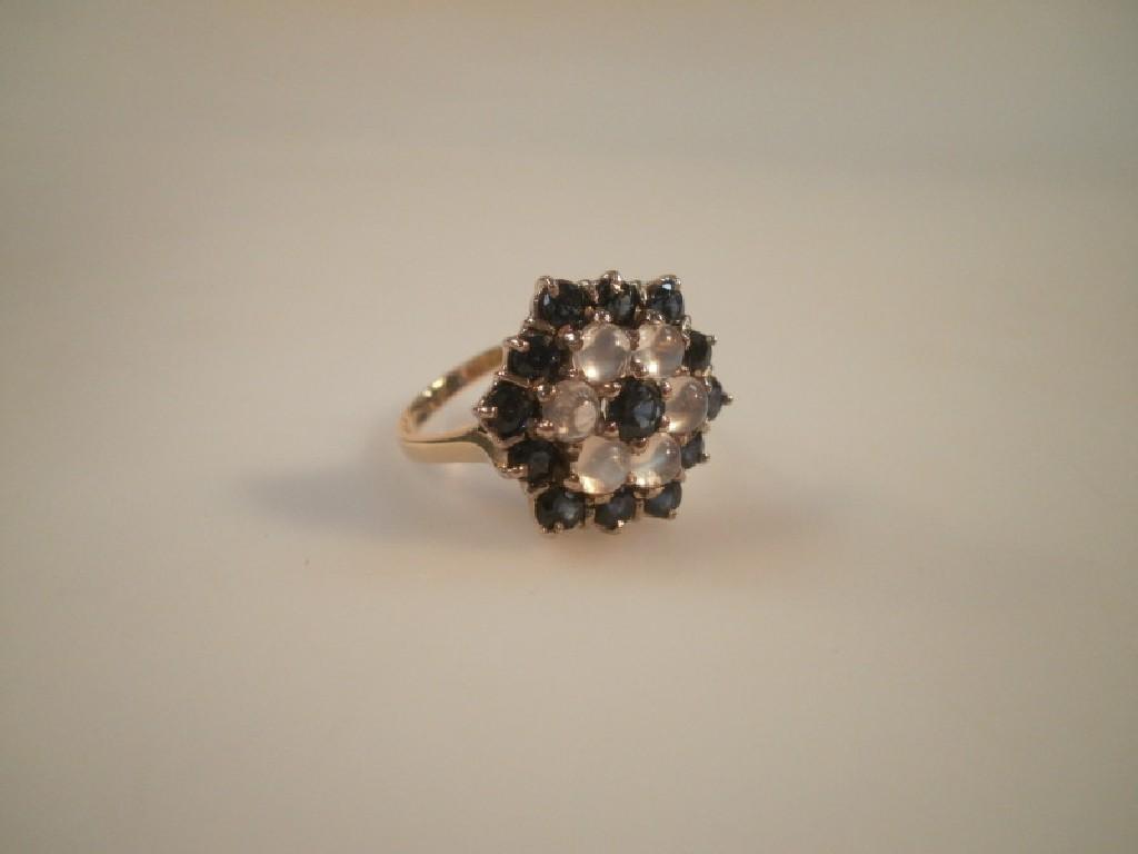 Appraisal: A sapphire and water opal set floral cluster ring in