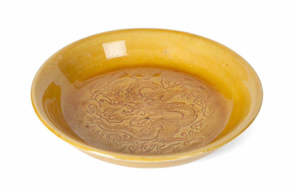 Appraisal: SMALL YELLOW-GLAZED MOULDED 'DRAGON' DISH QING DYNASTY TH CENTURY of