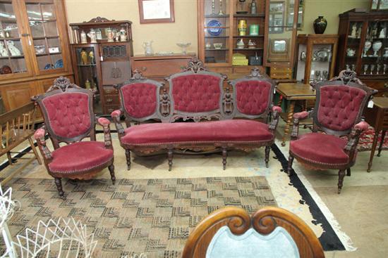 Appraisal: THREE PIECE VICTORIAN PARLOR SET Walnut with red upholstery and