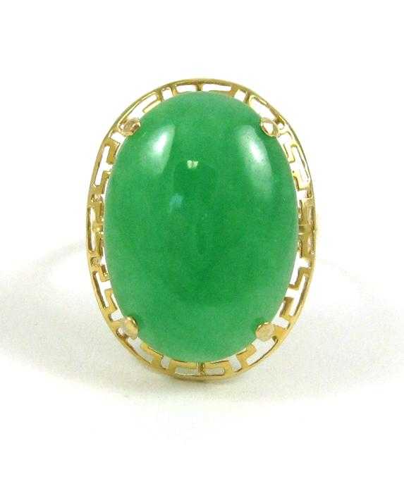 Appraisal: JADE AND FOURTEEN KARAT GOLD RING set with a single