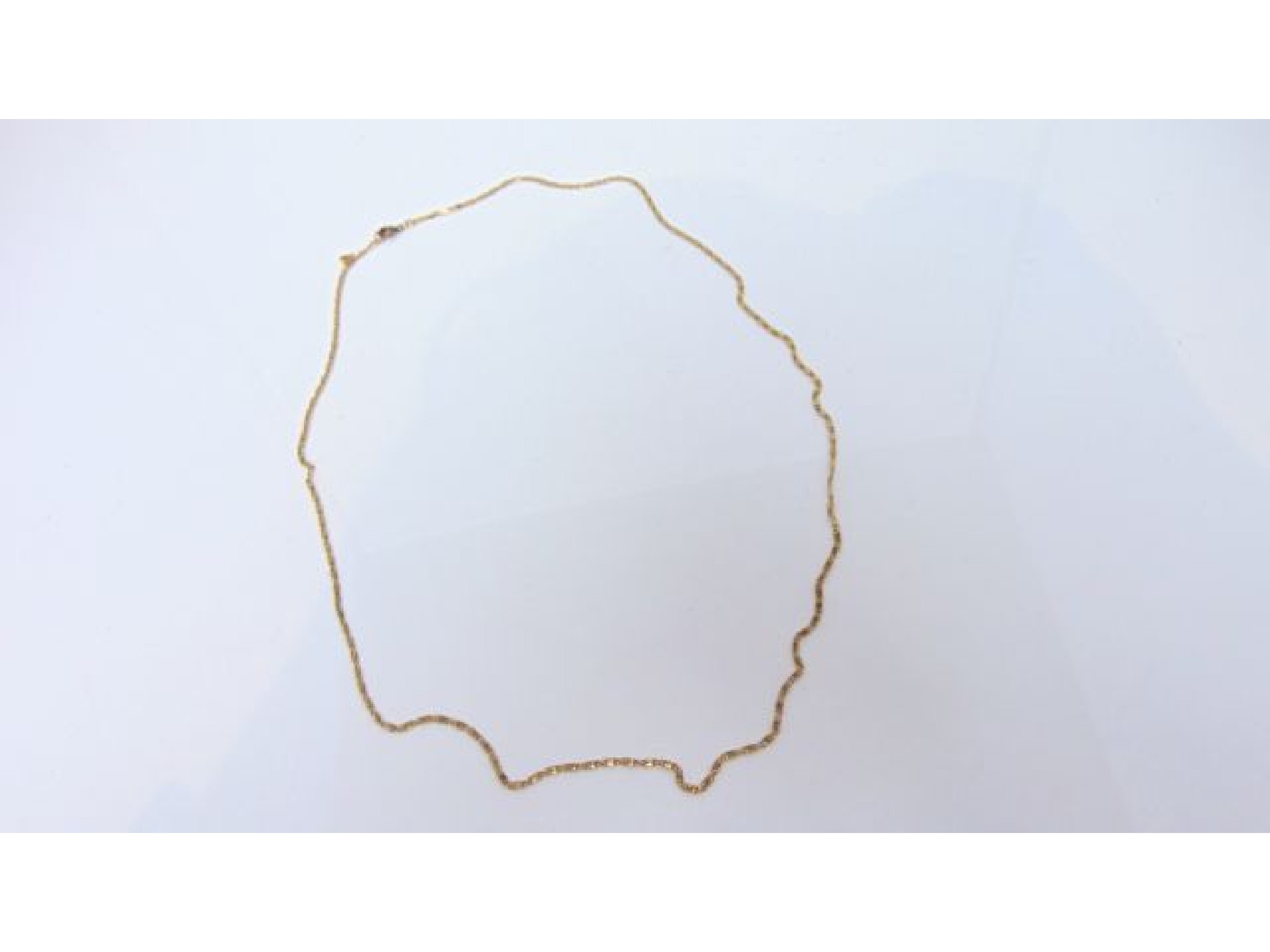 Appraisal: An unmarked gold necklace with later plated clasp g in