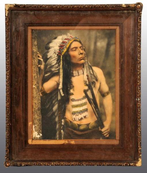 Appraisal: Painted Photograph of Native American Indian Description Framed under glass