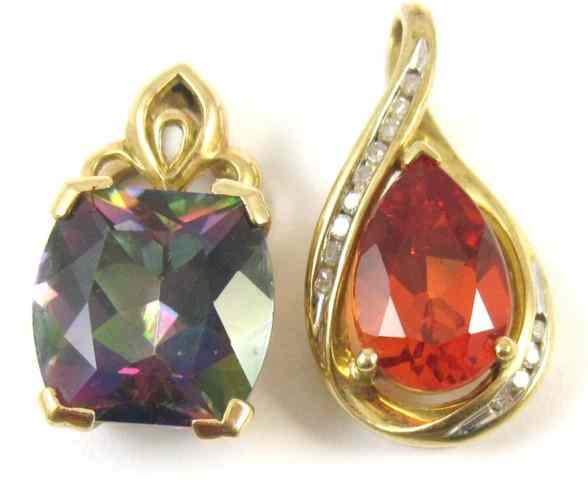 Appraisal: TWO TEN KARAT GOLD PENDANTS including a mystic topaz pendant