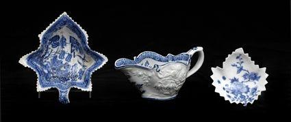 Appraisal: THREE ENGLISH BLUE AND WHITE ARTICLES Comprising a sauce boat