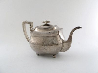 Appraisal: A George III silver tea pot of rounded rectangular form