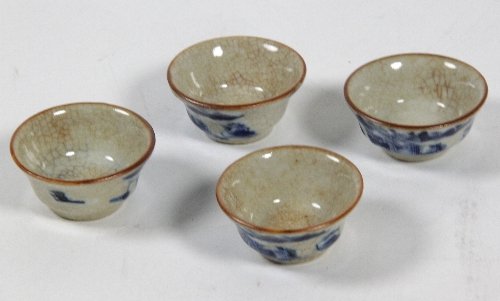 Appraisal: Four th Century miniature bowls decorated garden scenes in blue