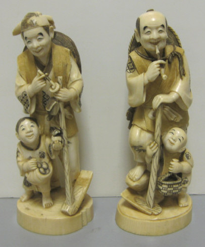 Appraisal: TWO FINELY CARVED JAPANESE FIGURES Depicting elders with children signed