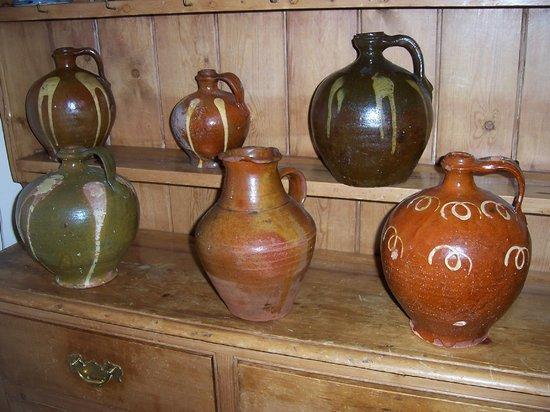 Appraisal: Six Spanish pottery slipware oil jugs cm and taller