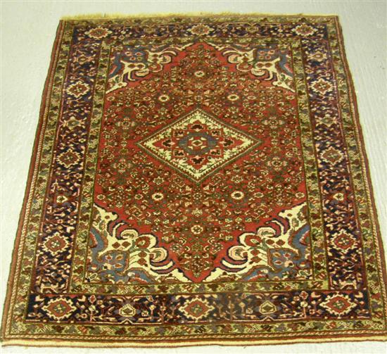 Appraisal: Persian red ground rug multiple borders with a lozenge shaped