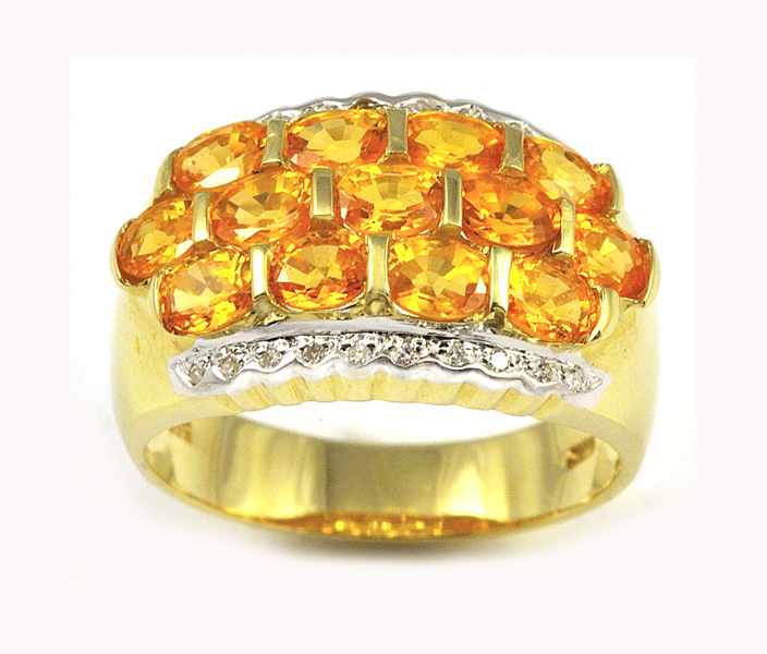 Appraisal: YELLOW-ORANGE SAPPHIRE AND DIAMOND RING k yellow and white gold