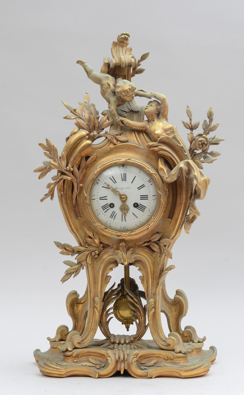 Appraisal: LOUIS XV STYLE GILT-BRONZE MANTLE CLOCK The in enamel dial