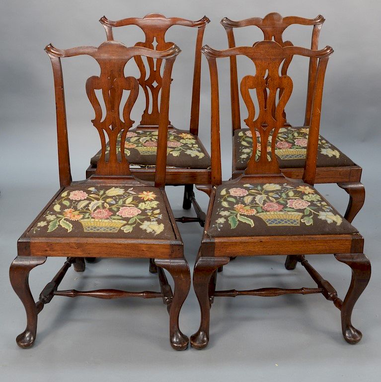 Appraisal: Set of four walnut side chairs with pierced vase shaped