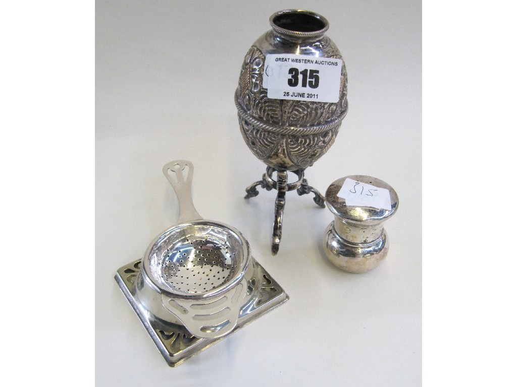 Appraisal: Lot comprising white metal vase tea strainer and a pepper