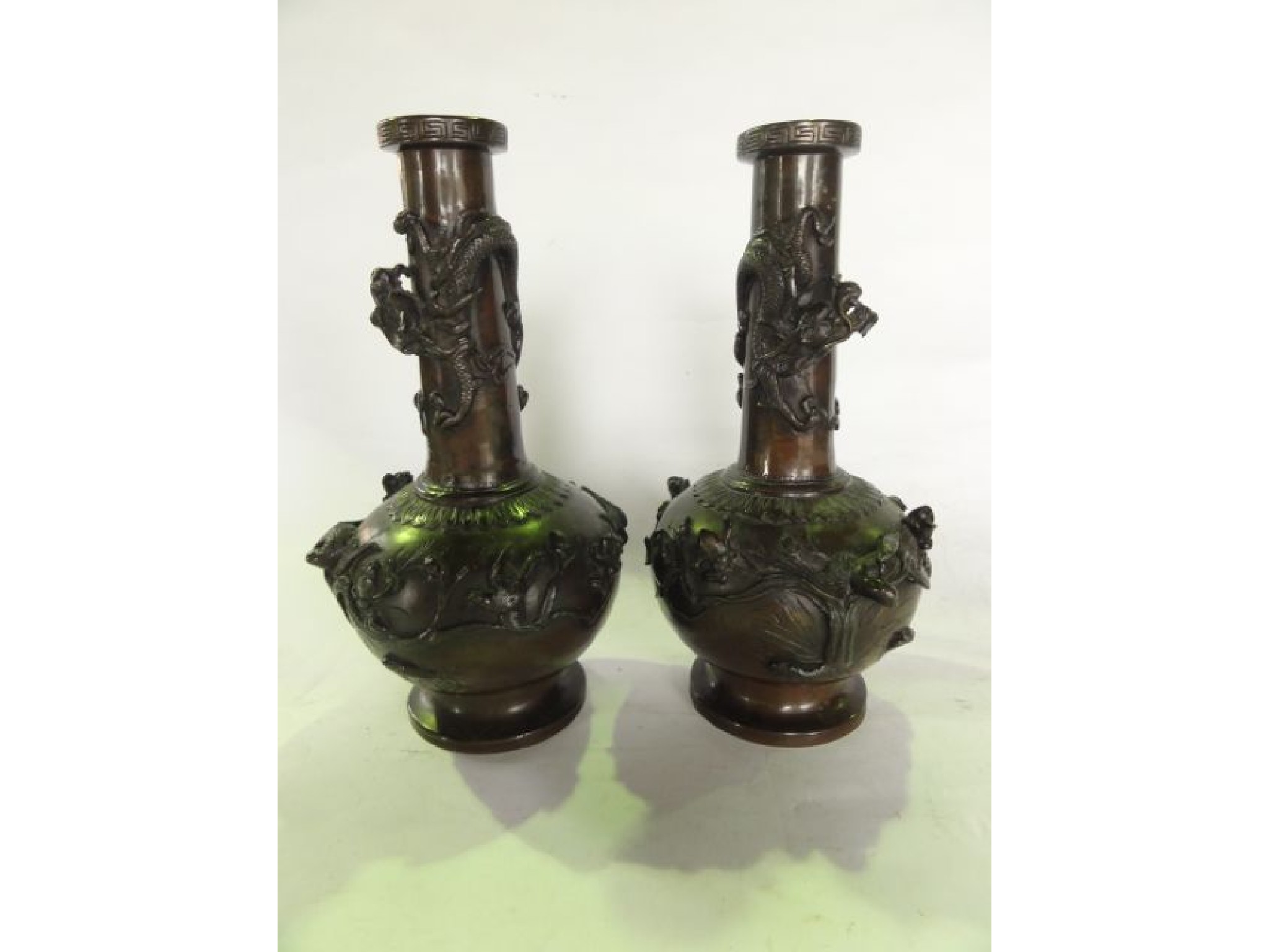 Appraisal: A pair of Chinese cast bronze vases of bulbous form