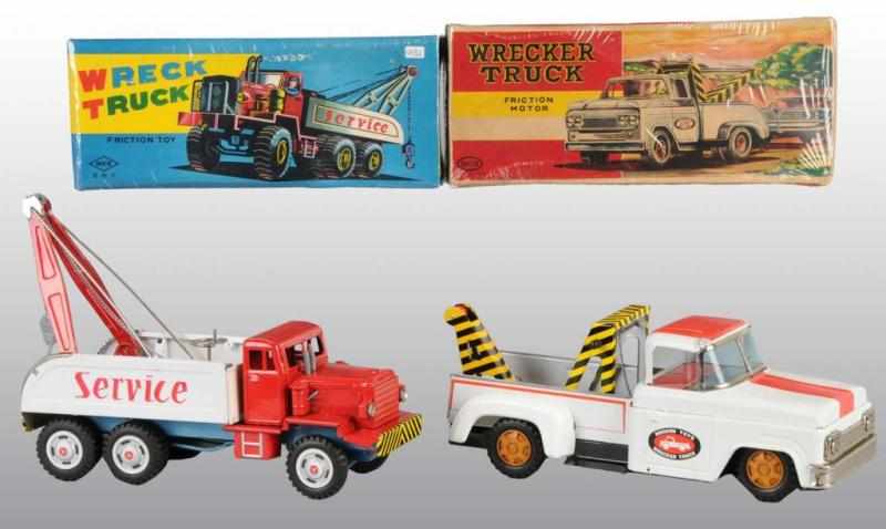 Appraisal: Lot of Tin Wrecker Truck Friction Toys Description Japanese Working