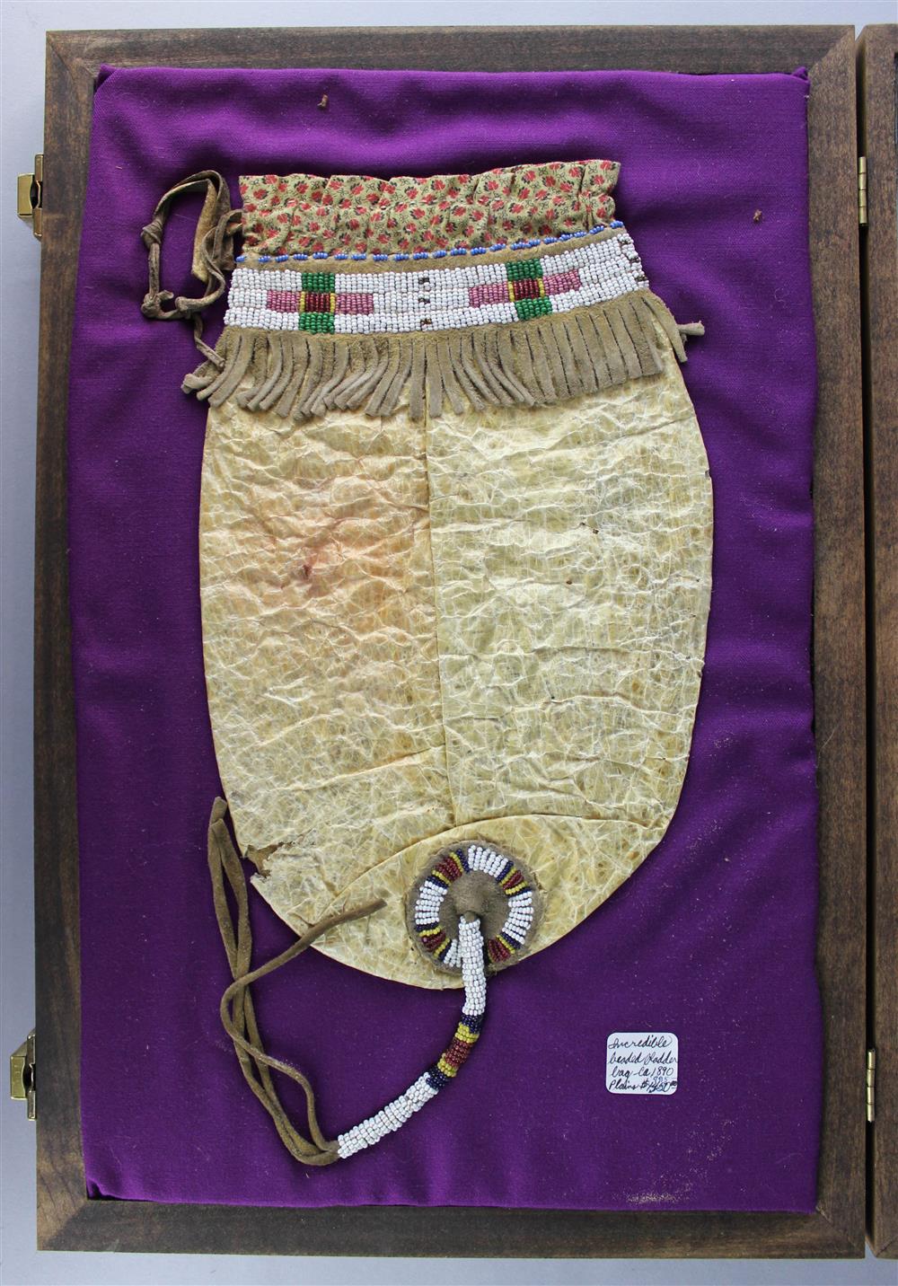 Appraisal: PLAINS BEADED BLADDER BAG in display case Provenance a Virginia