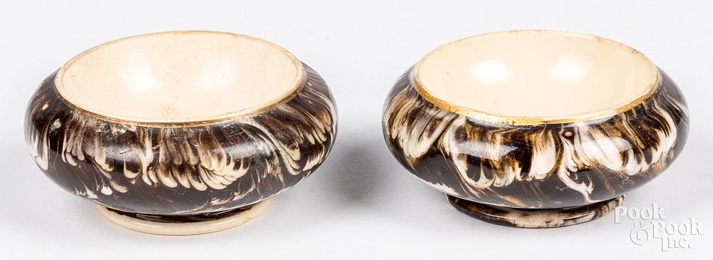 Appraisal: Pair of English marbleized mocha salt dips Pair of English