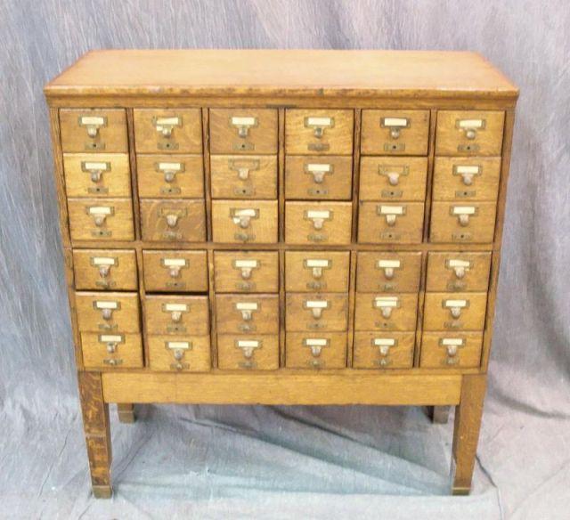 Appraisal: Oak Multi Drawer Filer With raised panels stack A base