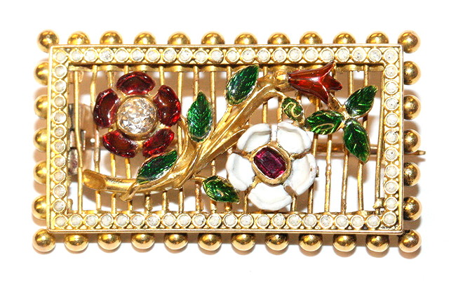 Appraisal: A DIAMOND RUBY AND ENAMEL FLORAL BROOCH two enamelled flowers