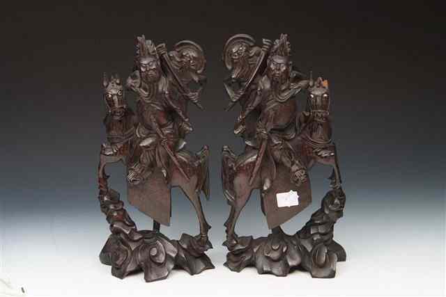 Appraisal: A PAIR OF CHINESE CARVED AND INLAID WOOD CARVINGS of