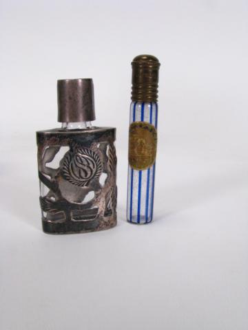 Appraisal: Glass perfume bottle with sterling overlay and lid high and