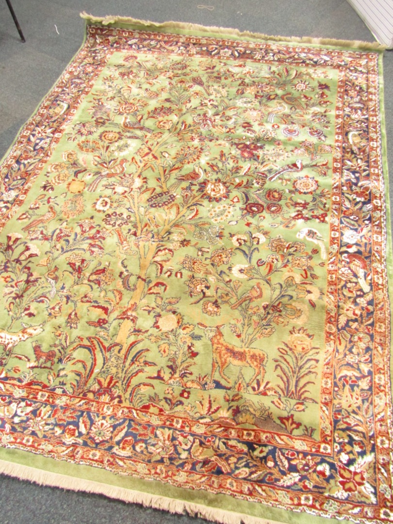 Appraisal: A Shiraz rug decorated with a tree of life animals