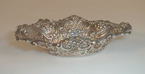 Appraisal: An Edwardian silver oval bon bon dish of pierced rococo