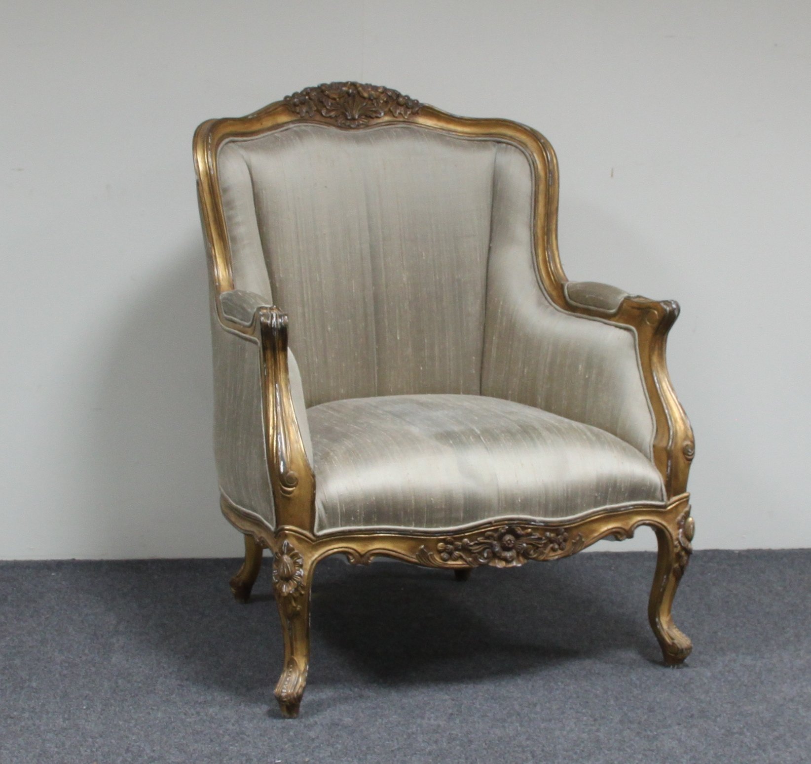 Appraisal: A carved giltwood framed armchair on cabriole legs