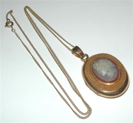 Appraisal: An oval locket with chain the locket applied to the