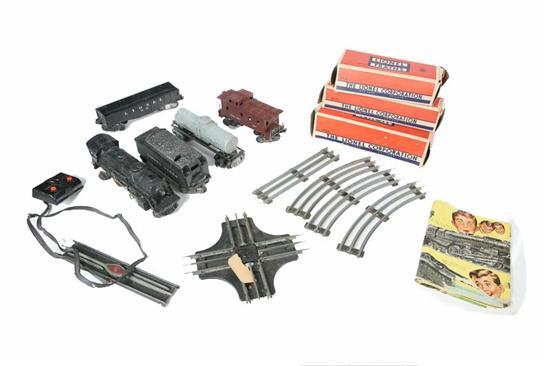 Appraisal: LIONEL TRAIN CARS Set includes a engine T tender gondola