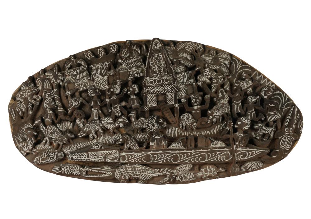 Appraisal: OCEANIC OVAL RELIEF-CARVED WOOD STORYBOARDmost likely Papua New Guinea modern