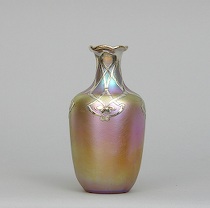 Appraisal: A Signed Quezal Vase with Silver Overlay Iridescent vase features