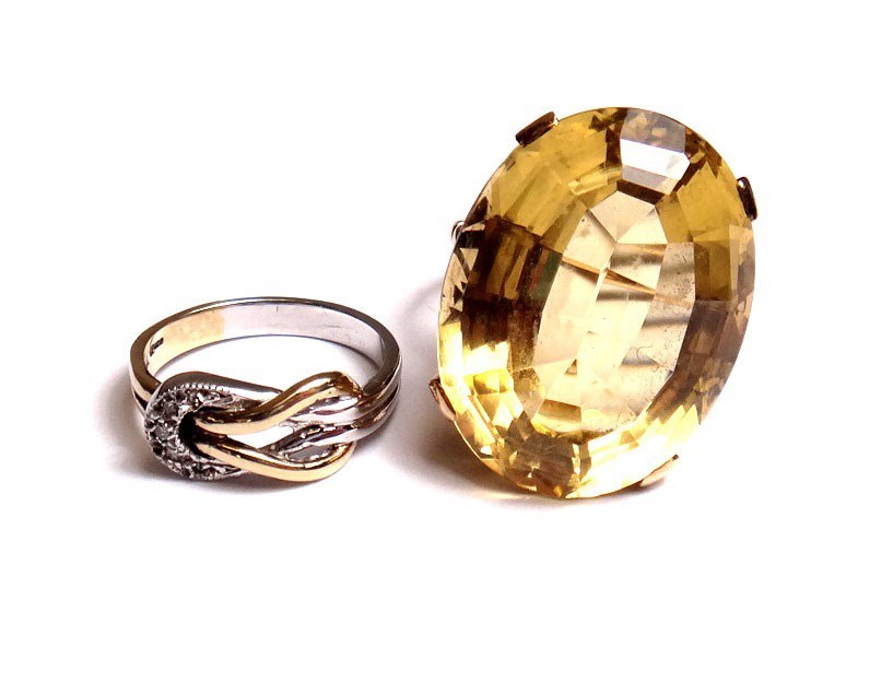 Appraisal: A gold ring claw set with a large oval cut