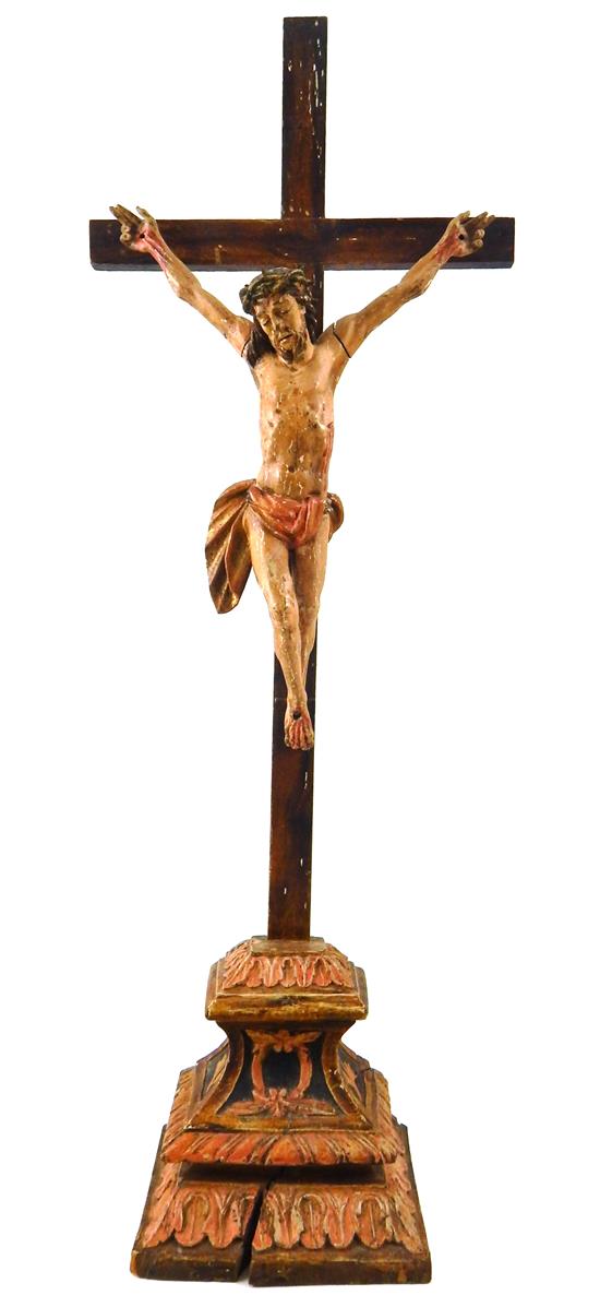 Appraisal: Early painted wooden crucifix on beveled plinth decorated with acanthus