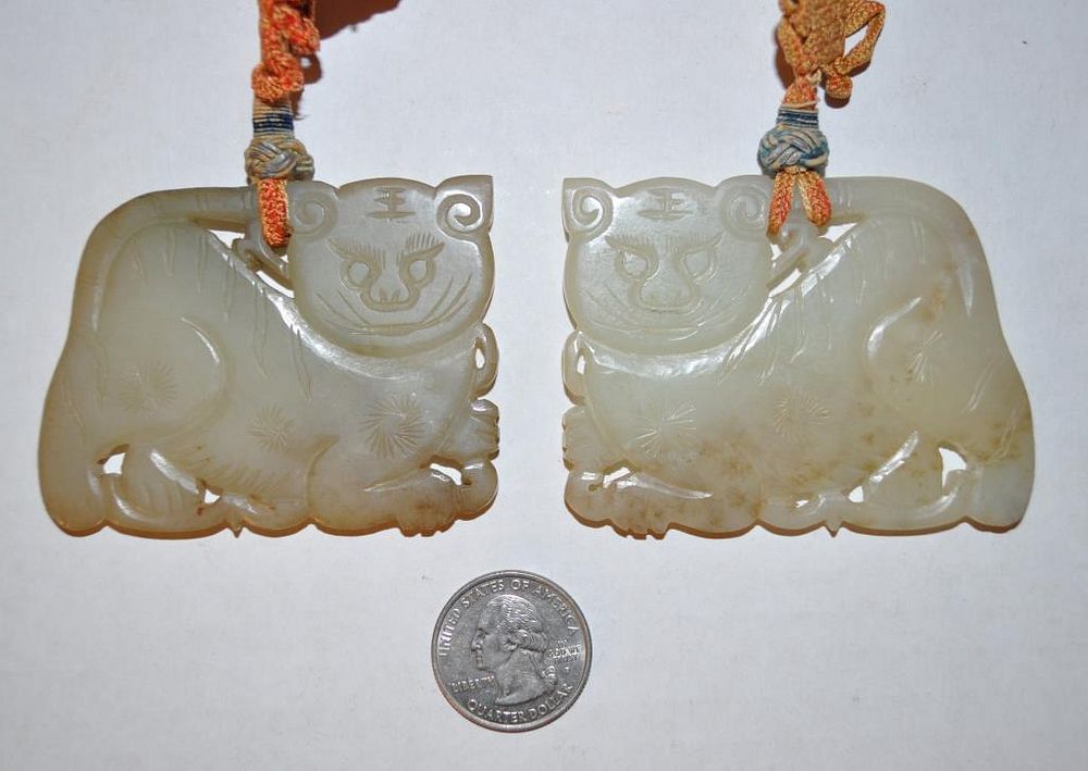 Appraisal: Pair Carved Jade Tiger Pendants on hand knotted rope both