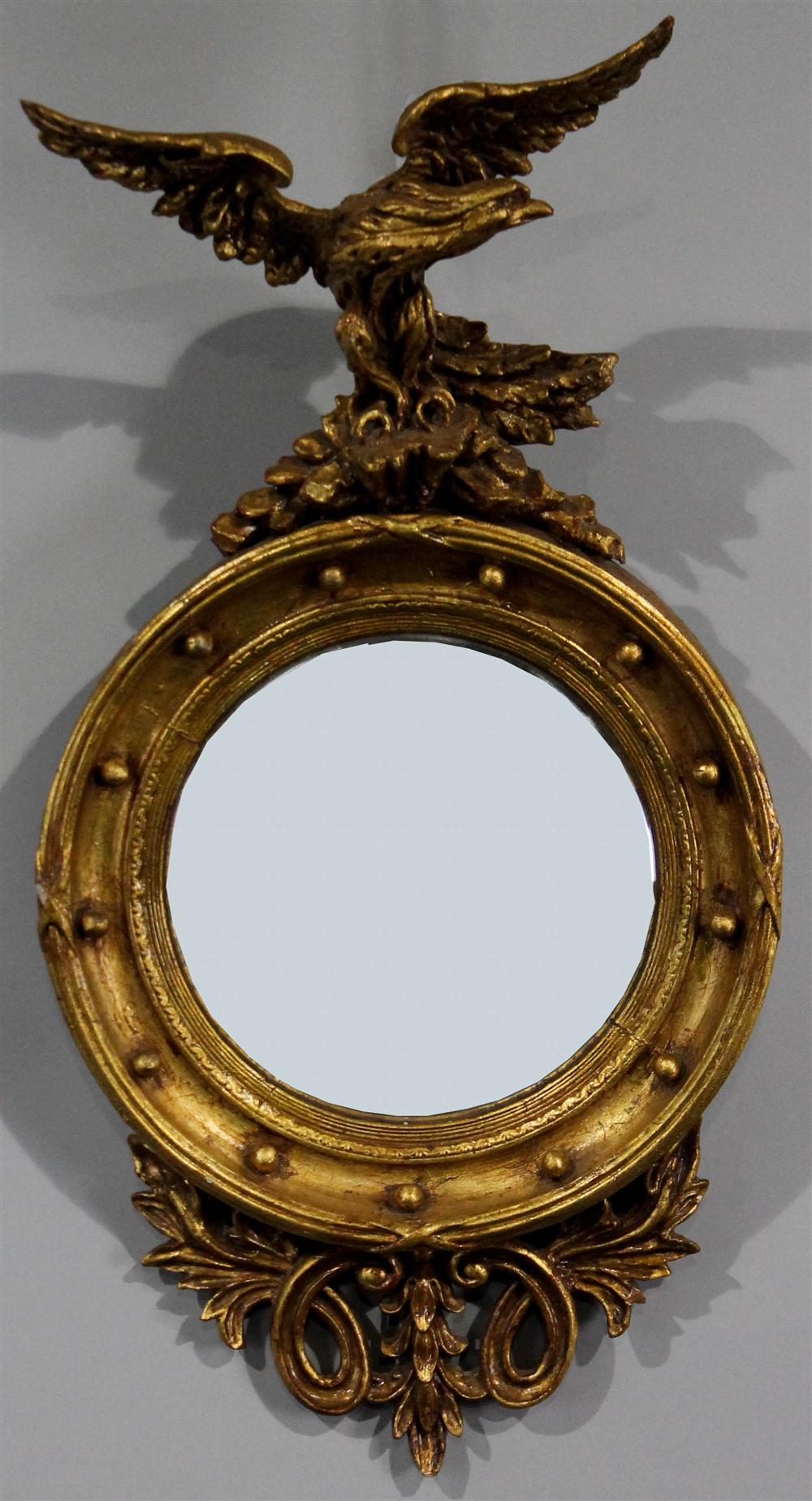 Appraisal: REGENCY STYLE CARVED GILTWOOD CONVEX MIRROR WITH EAGLE having a