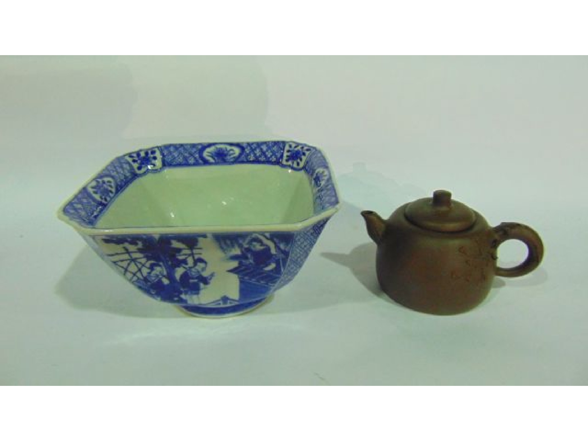 Appraisal: An oriental bowl of four sided square shaped form with