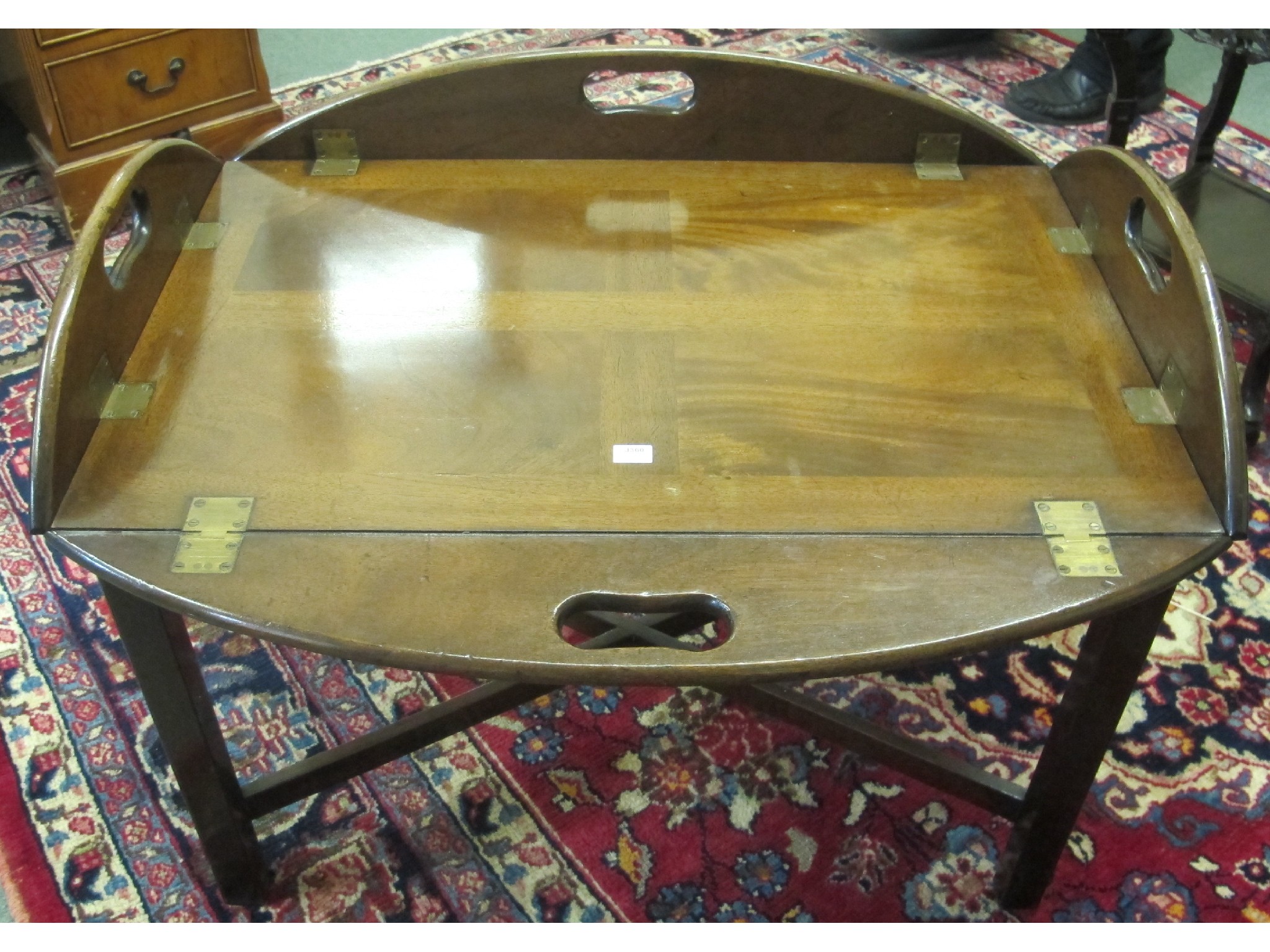 Appraisal: An Edwardian mahogany butlers tray on stand