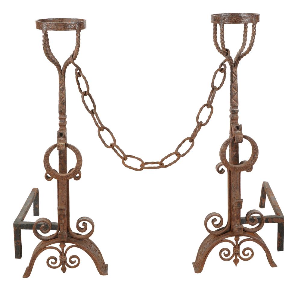 Appraisal: PAIR OF SPANISH REVIVAL WROUGHT IRON ANDIRONSwith a detachable chain