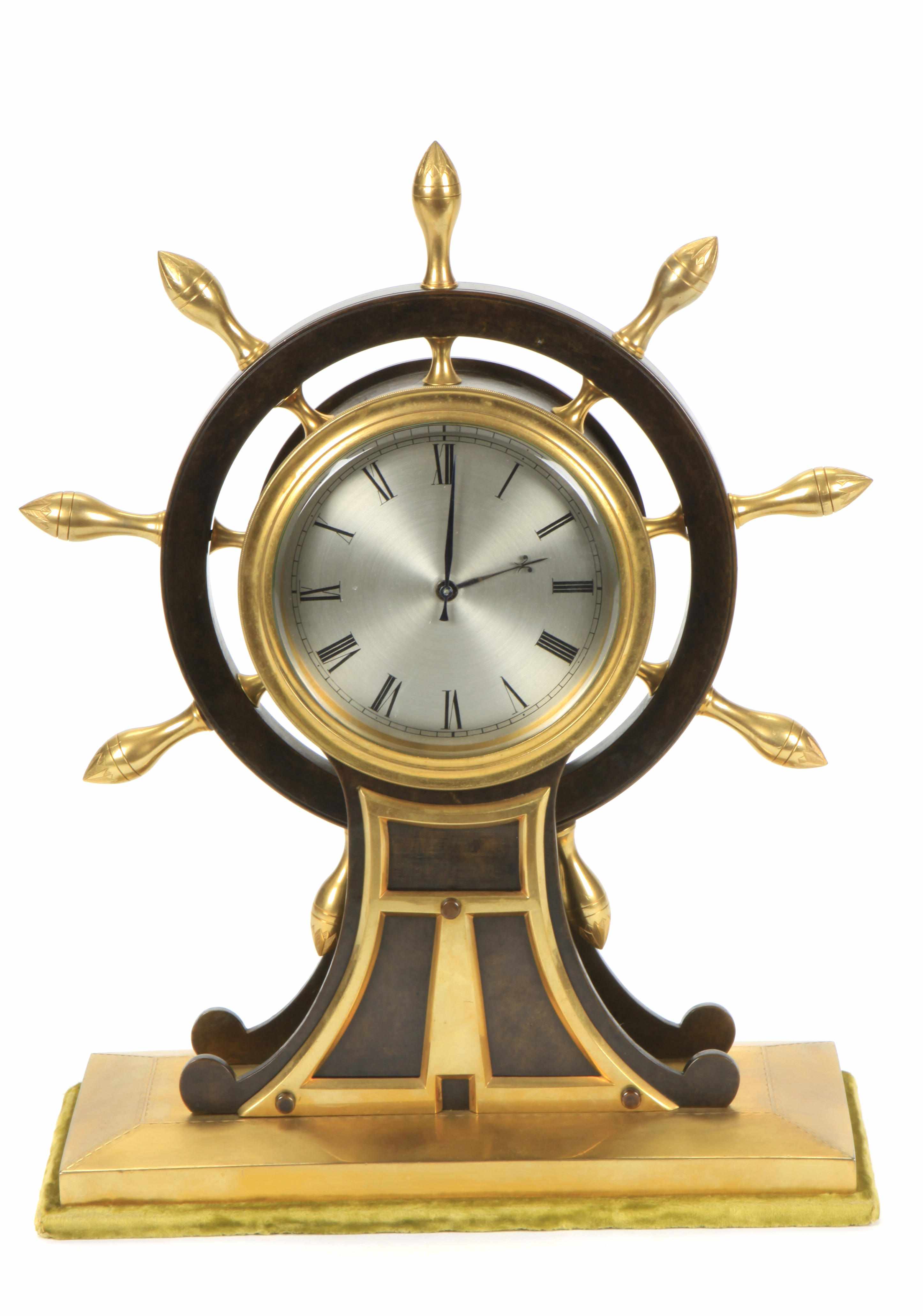 Appraisal: A patinated bronze and gilt brass ship's wheel mantel clock