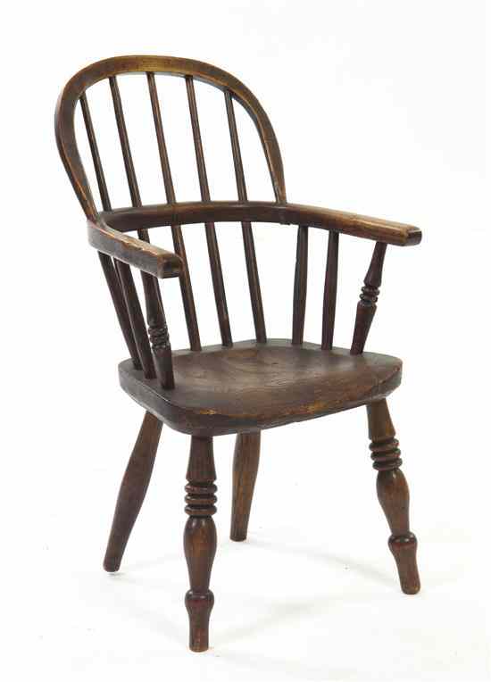 Appraisal: An English Oak Child's Windsor Armchair having a curved crest