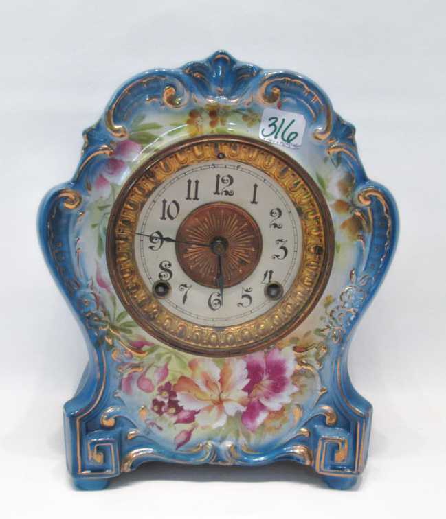 Appraisal: A ROYAL BONN ANSONIA PORCELAIN SHELF CLOCK with time and