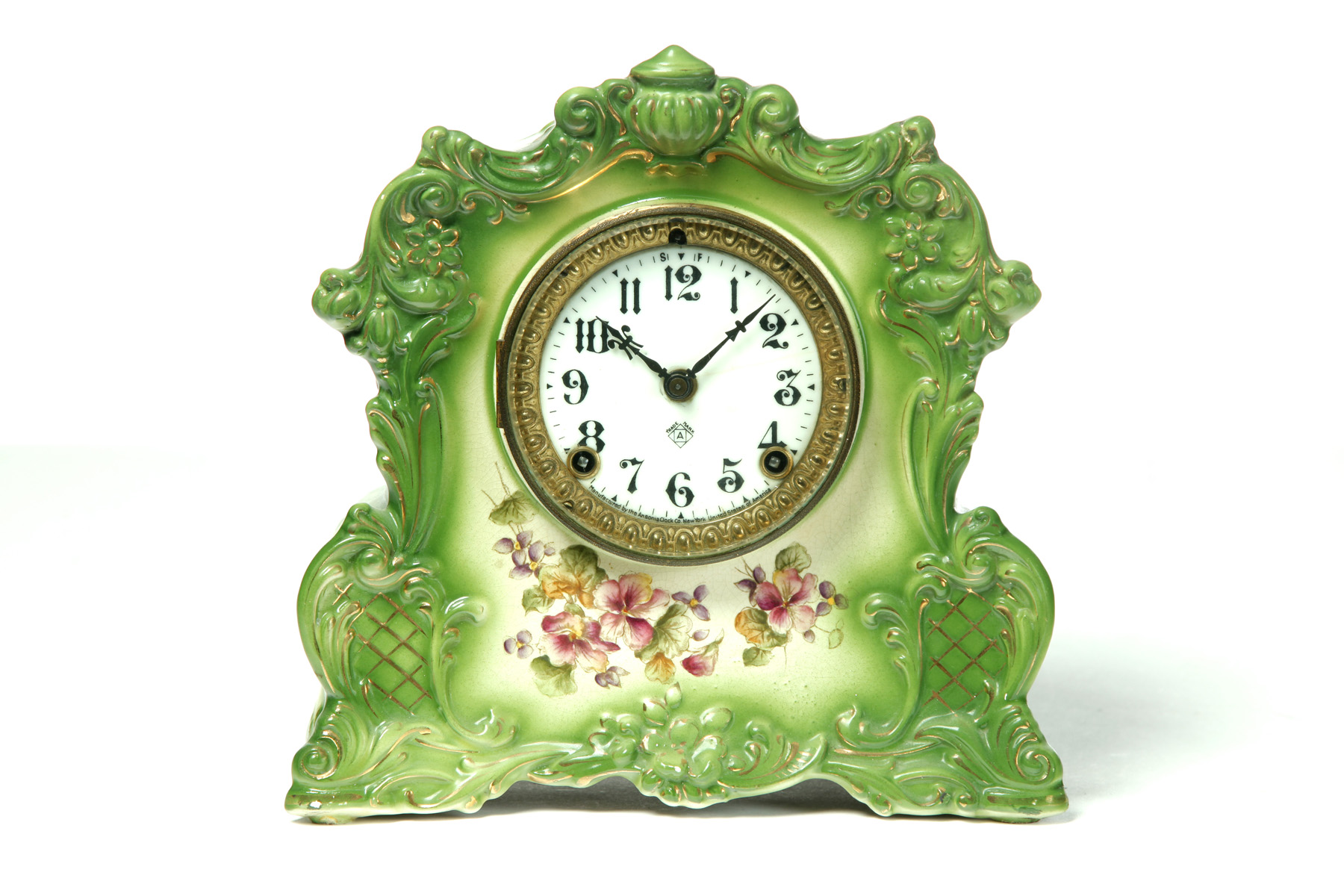 Appraisal: ANSONIA CHINA MANTEL CLOCK Earthenware case with green edging floral