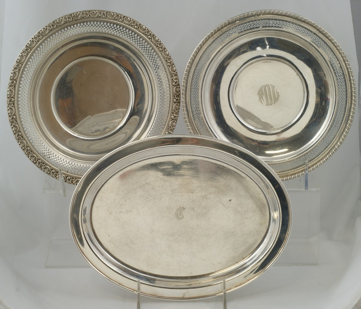 Appraisal: sterling silver trays round with pierced borders plain oval l