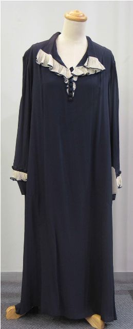 Appraisal: Dress in navy rayon with frilled white voile details to