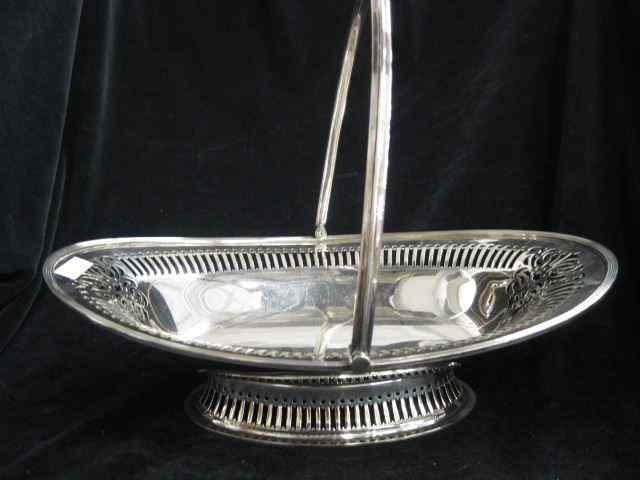 Appraisal: English Silverplate Basket fancy openwork swing handle '' x ''