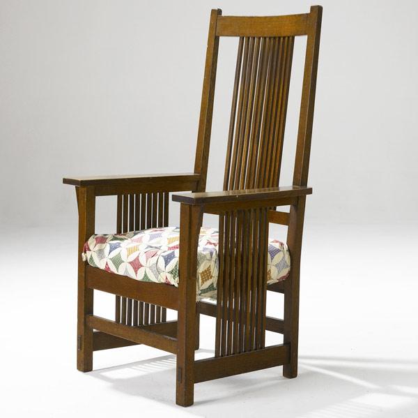 Appraisal: GUSTAV STICKLEY Tall-back spindled armchair no with upholstered drop-in seat