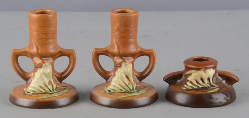 Appraisal: Lot of Roseville Pottery Candle Holders Three pairs of candlestick